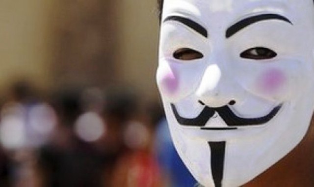 pendukung-anonymous-muncul-ke-publik-sambil-mengenakan-topeng